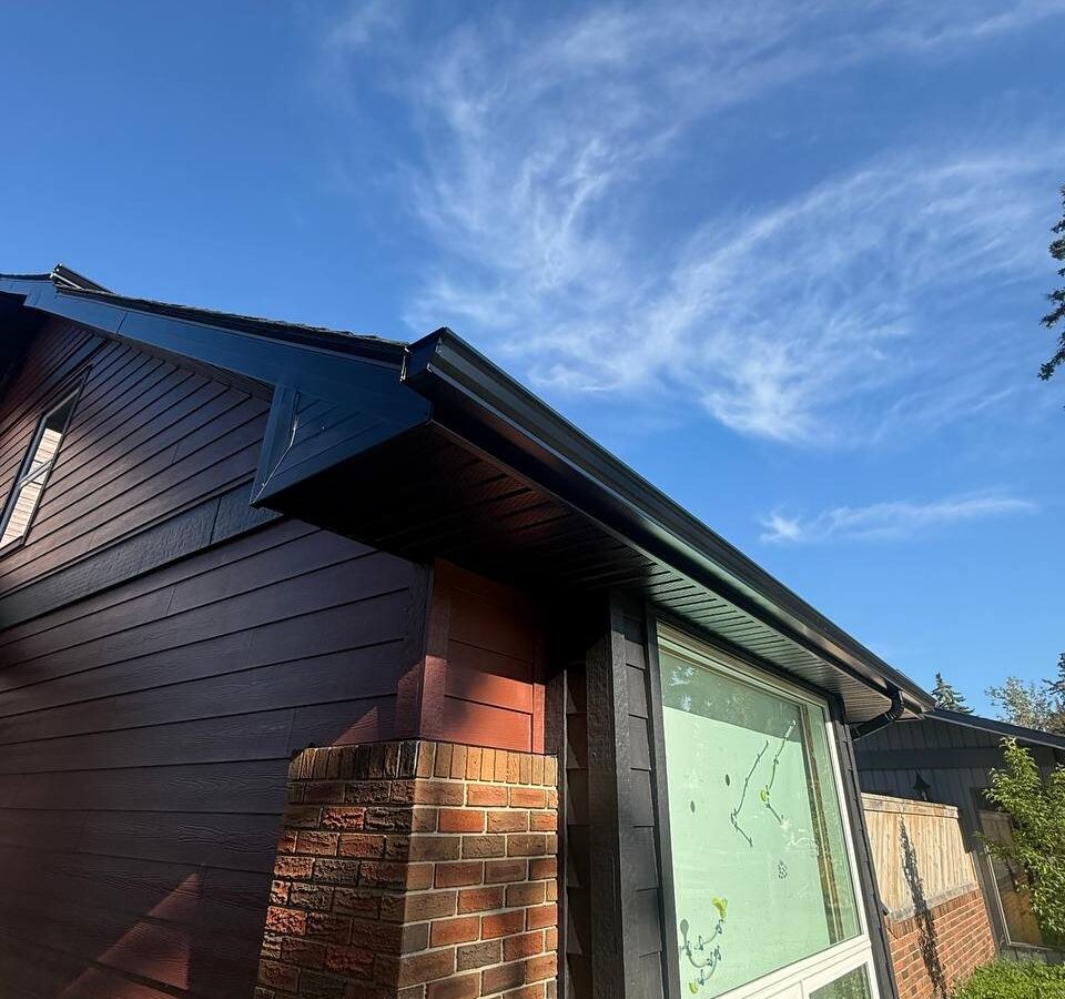 Eave detail from below: soffit, fascia and eavestrough on a finished siding job