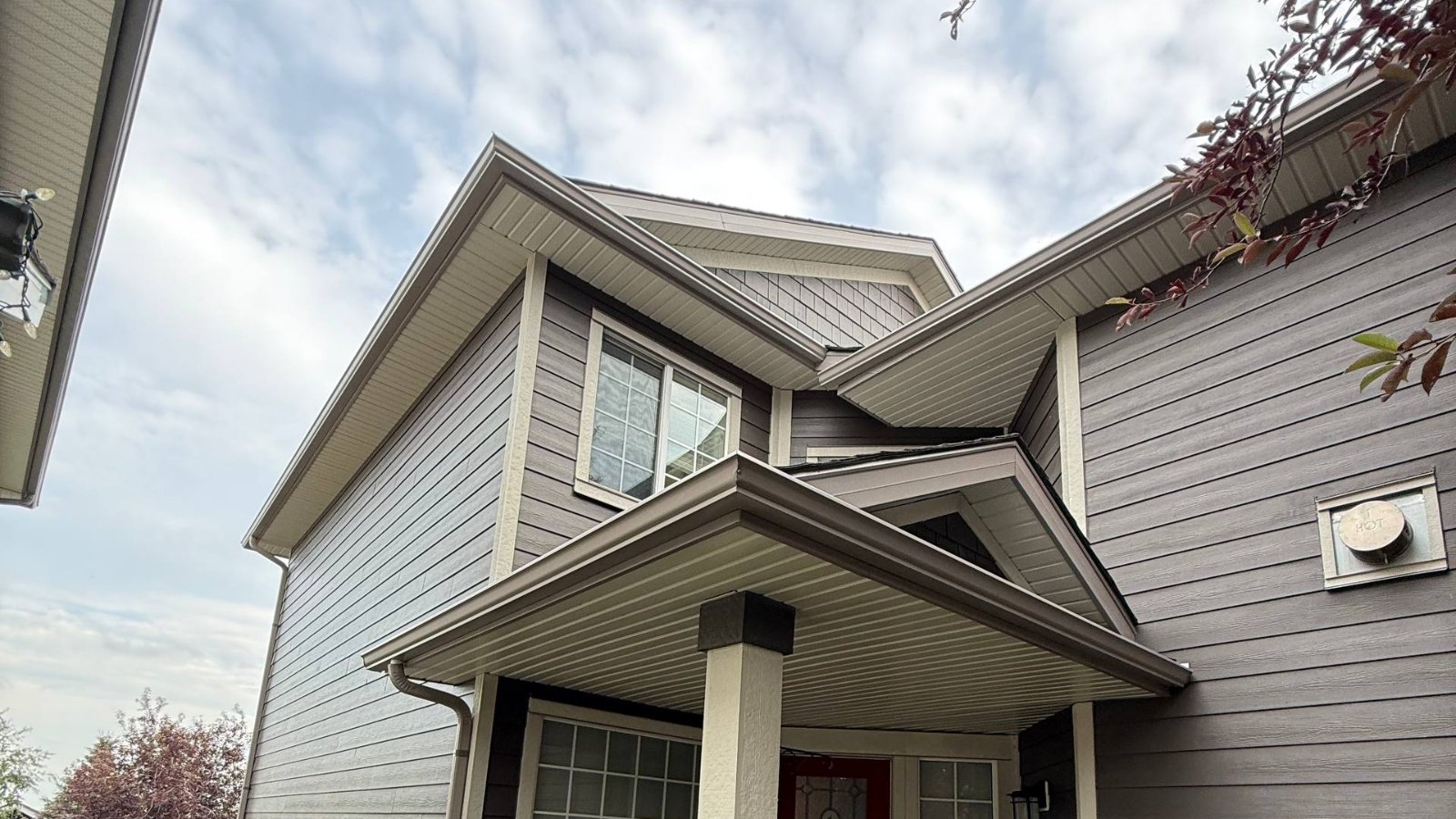 Soffit and fascia along the eaves and porch gable of a two-storey home