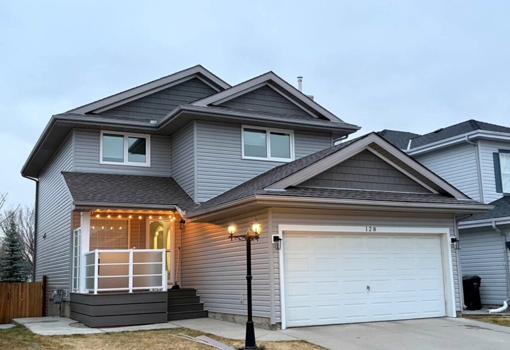 Vinyl siding on a two-storey home at dusk