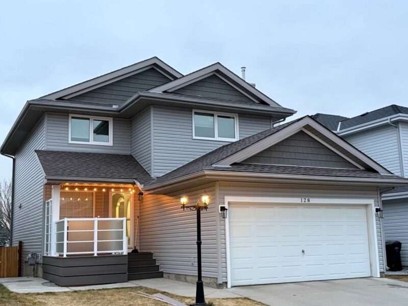 Vinyl siding on a two-storey home at dusk